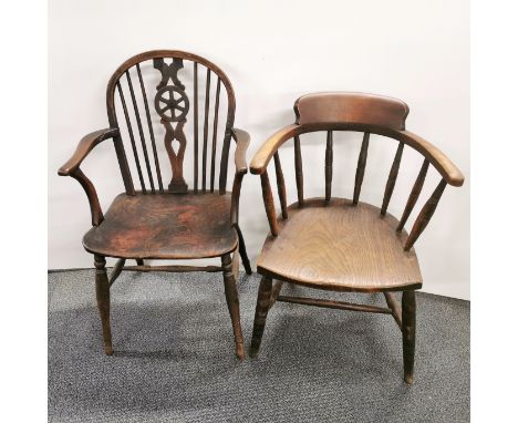 An elm captain's elbow chair with a further wheelback Windsor chair, tallest H. 91cm.