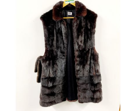 A sleeveless dark mink lady's jacket with belt, L. 96 cm.