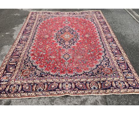 A large blue ground rug, 320 x 223cm.