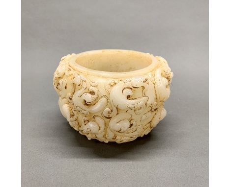 A Chinese carved jade/hardstone archaic form bowl decorated with dragons, Dia. 18cm Depth. 10cm.