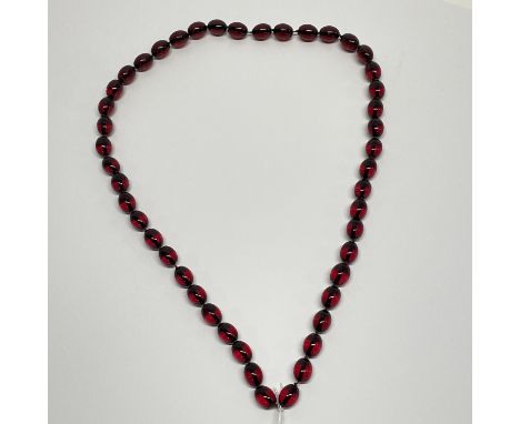 A faux cherry amber necklace, L. 44cm.