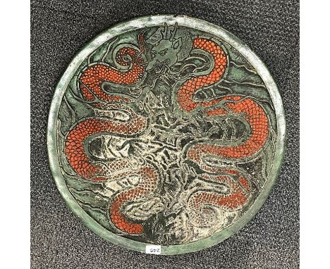 A painted concrete Chinese dragon tile, dia. 60cm.