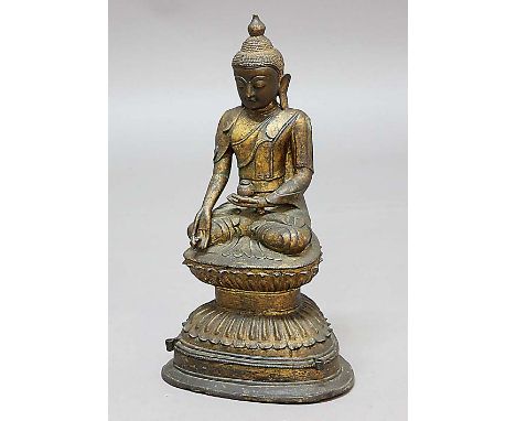 THAI GILT BRONZE BUDDHA, seated in meditation on a double lotus and stepped base with two candle holders, height 46cm Provena