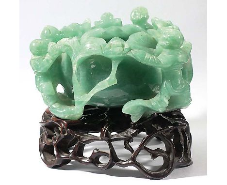 CHINESE JADE TYPE LOTUS BOWL, carved with three figures around the outside, on a pierced hardwood stand, excluding stand heig