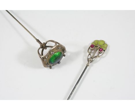 AN ART NOUVEAU HAT PIN the head mounted with blue and green enamel decoration, together with another Art Nouveau silver, enam