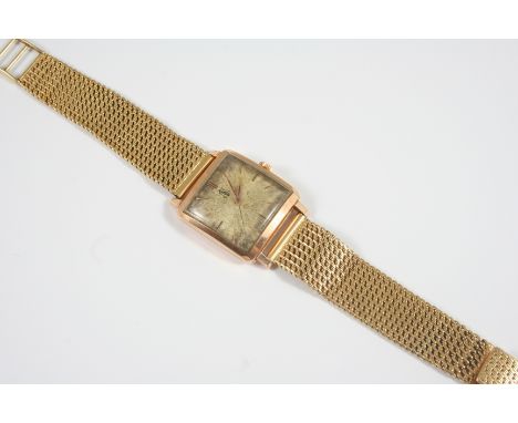 A 14CT. ROSE GOLD AUTOMATIC WRISTWATCH BY OMEGA the square-shaped dial with baton numerals and bearing a portrait of Sheikh I