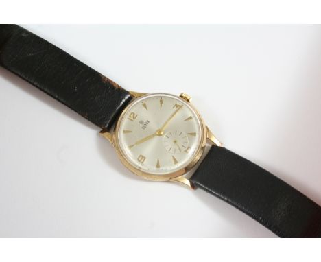 A GENTLEMAN'S 9CT. GOLD MECHANICAL WRISTWATCH BY TUDOR ROLEX the signed white enamel dial with Arabic quarters and baton nume