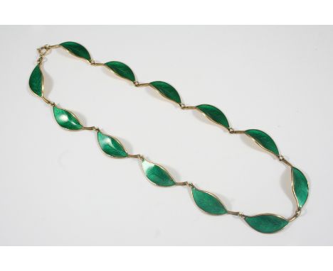 A SILVER GILT AND ENAMEL NECKLACE BY DAVID ANDERSEN formed as leaves set with green enamel in silver gilt, maker's mark to th