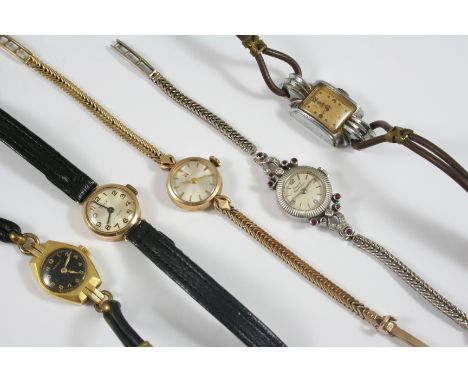 A LADY'S 9CT. GOLD WRISTWATCH BY TISSOT the signed circular dial with baton numerals, on a gold herringbone link bracelet wit