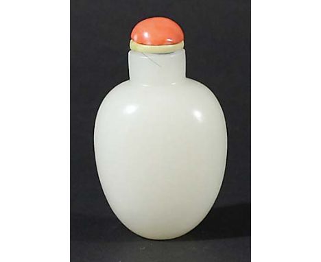 CHINESE WHITE JADE SNUFF BOTTLE AND STOPPER, of ovoid form, with a coral stopper, height 6cm