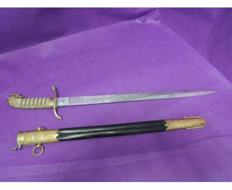 A British Midshipman's dirk with engraved blade, in very fine condition with scabbard. Blade length 46cm