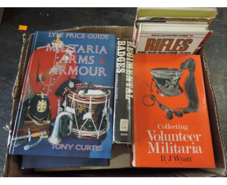 A collection of fourteen books on militaria, collection including military insignia, miltaria arms and armour, Lyle arms and 
