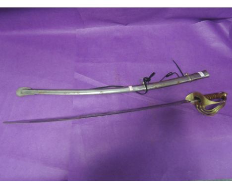 A late 18th century Indian Cavalry sword with metal scabbard possibly a copy