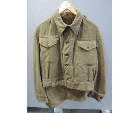 A khaki military blouse and trousers