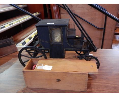 Wooden model horse drawn carriage, black painted with gold line decoration together with a Nicol toys wooden train set 