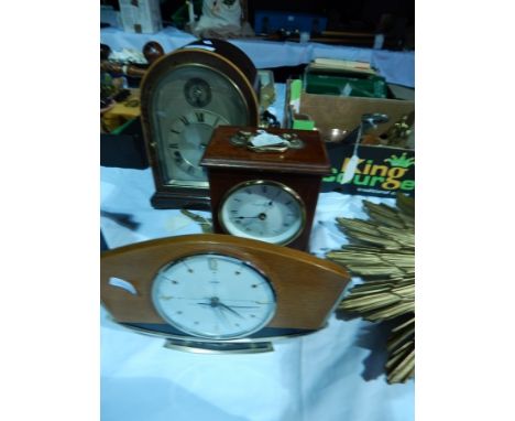 A mahogany domed cased mantel clock with silver dial, with striking and chiming movement, height 26cm, a mahogany cased mante
