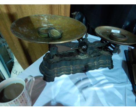 Cast iron weighing scales with two copper weighing plates and weights 