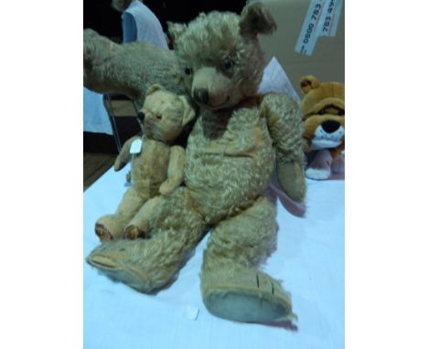 Gold plush teddy bear with glass eyes, 65cm and another smaller straw filled teddy bear 