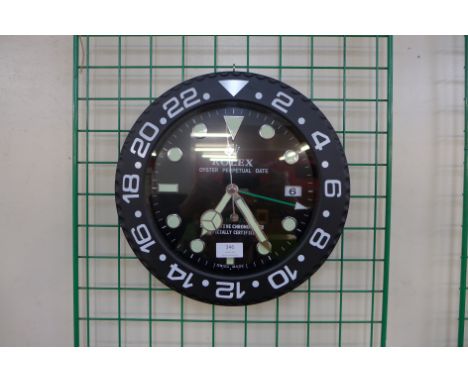 A Rolex style dealer's display wall clock 