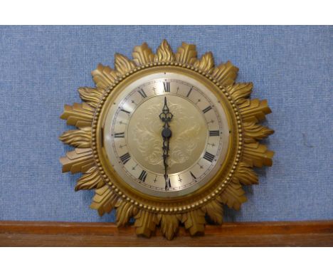 A gilt sunburst wall clock 