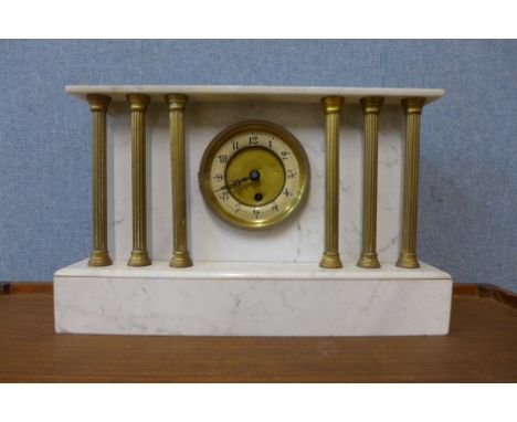 A 19th Century French marble and brass architectural cased mantel clock 