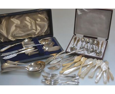 A pair of 19thc mother of pearl carved salt spoons, six various other mother of pearl spoons and a fork, a collection of whit