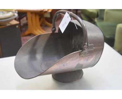 An Edwardian copper coal helmet with adjustable swing handle, raised on circular moulded base (restored) (internal: h.30cm x 