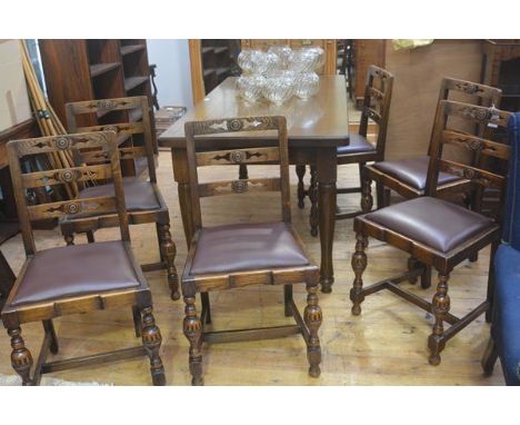 A set of six 1920's oak Jacobean ladder back dining chairs with inset seats. 87cm high