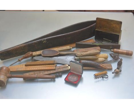 A collection of kitchenalia including bread knives, carving knives, wooden spoon, North British Restaurant corkscrew, a meat 