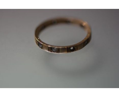 A 9ct gold clear stone set eternity style ring, (one stone lacking), 1.7grams, size M
