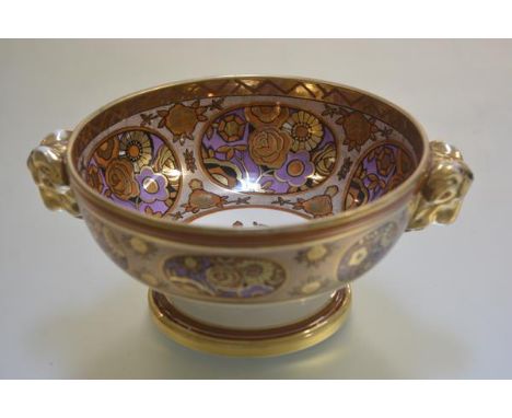 A Noritake fruit bowl decorated with exotic rose design with amethyst oval panels outlined in coral reserves, with rams head 