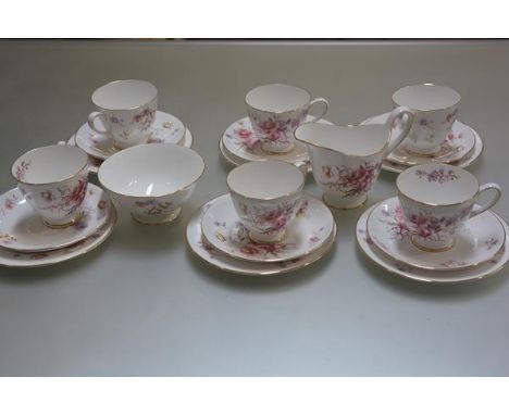 A Tuscan China Fragrance pattern twenty piece teaset with transfer printed enamel floral sprays, complete with sugar bowl and