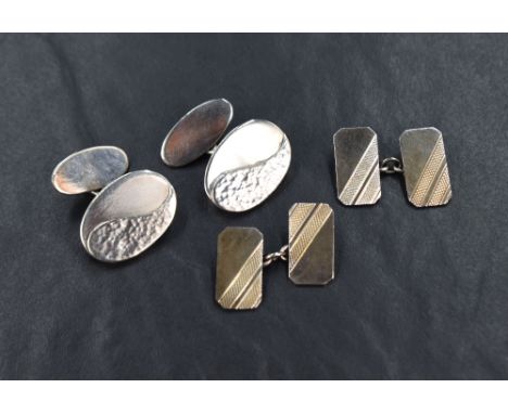 Two pairs of silver cufflinks, one being hand crafted with decorative front oval panels and bar connectors, the other pair ha