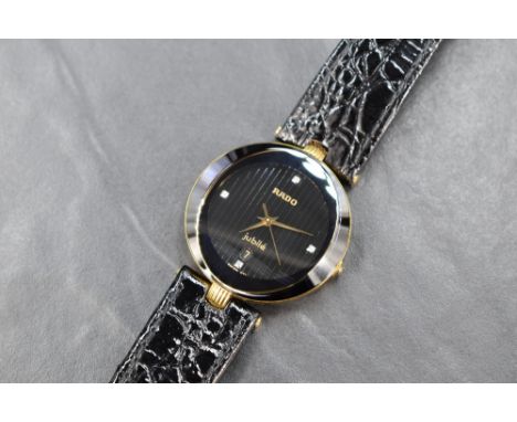 A lady's Rado Jubile gold plated wrist watch no: 129.3761.2 having crystal set quarter hour markers with date aperture on str