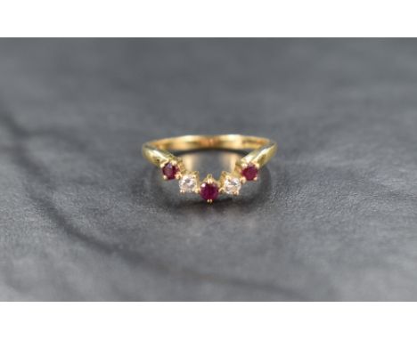 An 18ct gold ruby and diamond wishbone ring, the alternating rubies and diamonds measuring from approximately 0.05ct to 0.04c