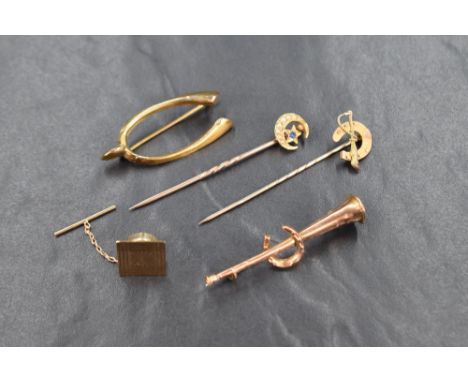 A collection of 18ct and 9ct gold jewellery, comprising three horse related brooches marked 9ct, a 9ct square pin and an 18ct