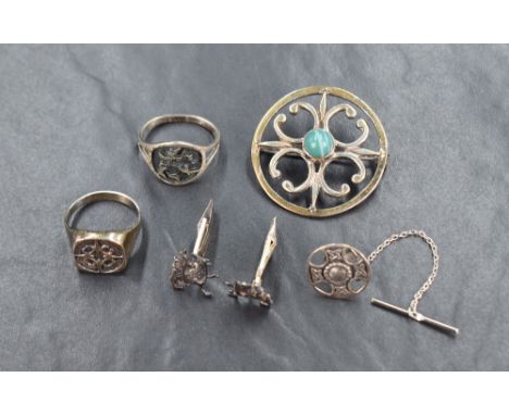 Three pieces of Scottish silver jewellery by Ola Gorie including gents's Maeshowe Dragon cufflinks and St Magnus ring, a St M