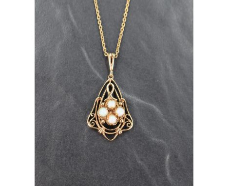 A 9ct gold pendant having three small opal cabochons in an open decorative mount on a 9ct gold chain, approx 18' &amp; 5.7g