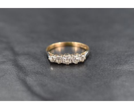 An 18ct gold five stone diamond ring, the graduated diamonds measuring from approximately 0.10ct to 0.05ct, ring size M-N, 2.