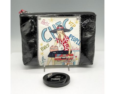 Black patent leather pouch purse is decorated with travel poster and silver corner grommets. Red leather zipper pulls on top,