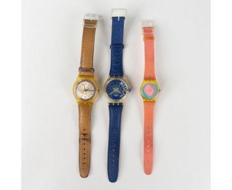 Three highly collectible Swatch watches sold as is. 1988 LK109 Luna Di Capri 25mm pink watch. 1993 SLK100 Musicall 33mm watch