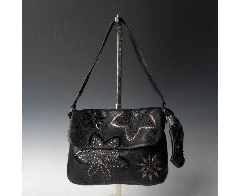 Black leather handbag decorated in a design with patent black and dark silver accents forming flowers. Interior pockets and z
