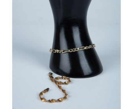 A beautiful twisted gold washed sterling silver bracelet and a unique light gold and silver chain bracelet. Both are marked 9