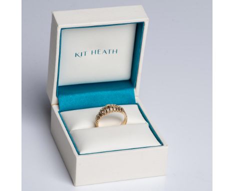 Beautiful yellow gold ring marked 14k inside the band. It has engraved ridges that catch the light and make the ring sparkle.