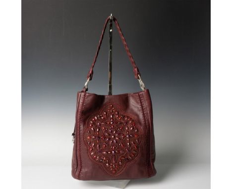 Burgundy leather handbag decorated with faceted and small round burgundy beads design in a floral shape. Interior zipped sect