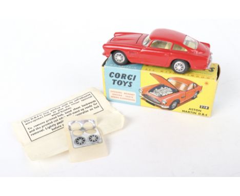 Corgi Toys  218 Aston Martin D.B.4, red body, yellow interior, flat spun wheel hubs, in near mint condition, with correct Cor