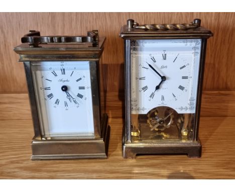 A French 8 day brass carriage clock, together with a German made example, each 12cm tall.(2) 