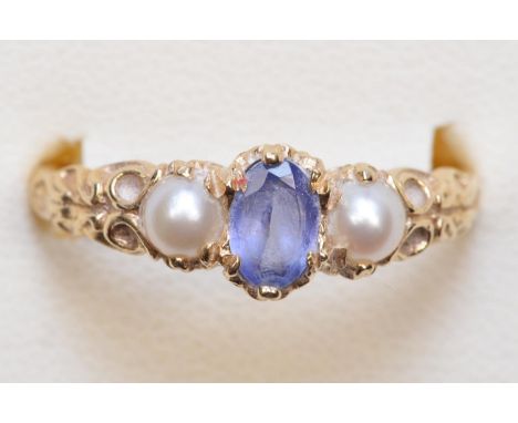 A 9ct gold tanzanite and cultured pearl three stone ring, Q 1/2, 2.6gm 