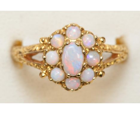 A vintage 9ct gold Victorian style opal cluster ring, London 1972, carved shoulders, O, 3.6gm 