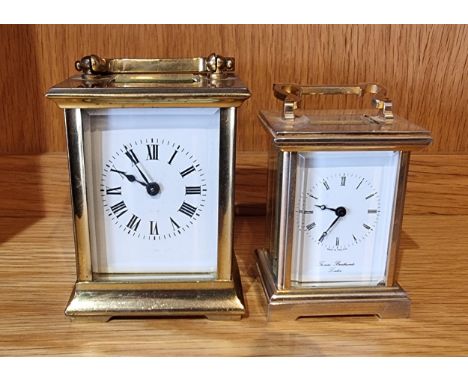 A mid 20th century brass cased 8 day carriage clock, the movement stamped 'France' 9cm tall, together with a smaller English 